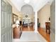 Inviting home foyer with a view into the living room with hardwood flooring at 8605 Sw 209Th Court Rd, Dunnellon, FL 34431