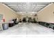 Spacious garage featuring high ceilings and ample space for storage or parking at 8605 Sw 209Th Court Rd, Dunnellon, FL 34431
