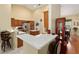 Well-equipped kitchen with bar seating, stainless appliances, and pantry at 8605 Sw 209Th Court Rd, Dunnellon, FL 34431