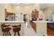 Open kitchen with breakfast bar, stainless steel appliances, and tile flooring at 8605 Sw 209Th Court Rd, Dunnellon, FL 34431