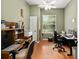 Comfortable office space with hardwood flooring, natural light, and functional layout at 8605 Sw 209Th Court Rd, Dunnellon, FL 34431