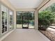 View of the screened patio showing access to the backyard at 8605 Sw 209Th Court Rd, Dunnellon, FL 34431