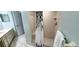 Bright bathroom featuring a walk-in shower with white tiling, double vanity, and neutral color palette at 8771 Sw 115Th St, Ocala, FL 34481
