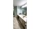 Bathroom with a sink, white cabinets, and marble tile floor at 8771 Sw 115Th St, Ocala, FL 34481