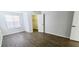 Bedroom featuring hard surface floors, a closet, and two entrance doors at 8771 Sw 115Th St, Ocala, FL 34481