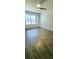 Bright bedroom with wood floors, ceiling fan, and natural light at 8771 Sw 115Th St, Ocala, FL 34481