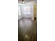 A bright bedroom with wood-look floors, a closet, and a large window at 8771 Sw 115Th St, Ocala, FL 34481