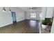 Bright, open living room with hardwood floors and plenty of natural light at 8771 Sw 115Th St, Ocala, FL 34481
