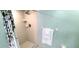 Bathroom with shower, tile surround, and a rainfall showerhead at 8771 Sw 115Th St, Ocala, FL 34481