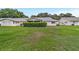 Expansive backyard featuring lush lawn and mature trees for privacy and enjoyment at 8841 Sw 91St St # A, Ocala, FL 34481