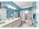 Bright bathroom with a bathtub, shower, and vanity with ample counter space at 8841 Sw 91St St # A, Ocala, FL 34481