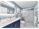Modern bathroom featuring a glass-enclosed shower, updated vanity, and contemporary fixtures at 8841 Sw 91St St # A, Ocala, FL 34481