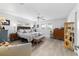 Spacious bedroom with light wood floors, a ceiling fan, and ample natural light at 8841 Sw 91St St # A, Ocala, FL 34481
