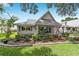 Charming single story home boasts a well-manicured lawn and a picturesque porch perfect for relaxing at 8841 Sw 91St St # A, Ocala, FL 34481
