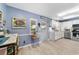 Well-lit kitchen featuring white cabinetry, stainless appliances, and ample counter space for meal preparation at 8841 Sw 91St St # A, Ocala, FL 34481