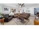 Cozy living room with plush seating, a ceiling fan, and hardwood floors at 8841 Sw 91St St # A, Ocala, FL 34481