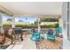 Relaxing screened-in patio with comfortable seating and a barbecue grill at 8841 Sw 91St St # A, Ocala, FL 34481