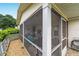 Inviting screened porch with ample seating for outdoor relaxation and entertaining at 8841 Sw 91St St # A, Ocala, FL 34481