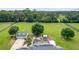Expansive horse property showcasing a pool, large lawn, and detached garage at 9095 Sw 9Th Ter, Ocala, FL 34476