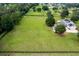 Large grassy lot with a well-maintained lawn and black fencing at 9095 Sw 9Th Ter, Ocala, FL 34476