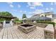 Backyard featuring outdoor seating, outdoor dining, pool and lounging area, and lovely stone fire pit at 9095 Sw 9Th Ter, Ocala, FL 34476