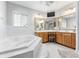 Luxurious bathroom with a large tub, and white tile at 9095 Sw 9Th Ter, Ocala, FL 34476