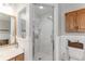Clean bathroom featuring a glass shower and tiled walls at 9095 Sw 9Th Ter, Ocala, FL 34476