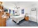 Bright bedroom featuring a ceiling fan, natural light, and wood furnishings at 9095 Sw 9Th Ter, Ocala, FL 34476