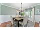 Cozy dining room featuring green accent walls and ample natural light at 9095 Sw 9Th Ter, Ocala, FL 34476