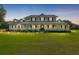 Stunning view of a two-story home with beautiful lighting at dusk at 9095 Sw 9Th Ter, Ocala, FL 34476