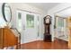 Bright foyer with wood floors and a decorative glass front door at 9095 Sw 9Th Ter, Ocala, FL 34476