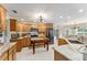 Spacious kitchen with marble countertops, wood cabinets, stainless appliances, and an island at 9095 Sw 9Th Ter, Ocala, FL 34476