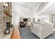 Bright and airy living room with a stone fireplace and high ceilings at 9095 Sw 9Th Ter, Ocala, FL 34476