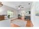 Bright and airy office space with hardwood floors, ceiling fan, and large window at 9095 Sw 9Th Ter, Ocala, FL 34476