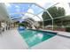 The pool is large, covered, and has a slide. The backyard is fully equipped with outdoor activities at 9095 Sw 9Th Ter, Ocala, FL 34476