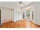 Spacious bedroom features wood floors, arched windows, and a closet, providing ample storage at 9180 Sw 202Nd Avenue Rd, Dunnellon, FL 34431