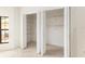 Two large closets with folding doors and ample shelving in the main bedroom at 9180 Sw 202Nd Avenue Rd, Dunnellon, FL 34431