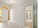 Bright entryway featuring neutral tile, decorative glass door, and lots of light at 9180 Sw 202Nd Avenue Rd, Dunnellon, FL 34431