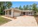 Beautiful home featuring an attached garage and a large brick driveway at 9180 Sw 202Nd Avenue Rd, Dunnellon, FL 34431