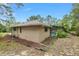 Home exterior with a screened-in pool area, showcasing the property's backyard features at 9180 Sw 202Nd Avenue Rd, Dunnellon, FL 34431