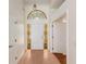 Bright foyer featuring tiled flooring, stained glass accents, and high ceilings, offering a grand entrance at 9180 Sw 202Nd Avenue Rd, Dunnellon, FL 34431