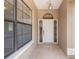 Charming entryway with decorative glass windows and overhead light fixture at 9180 Sw 202Nd Avenue Rd, Dunnellon, FL 34431
