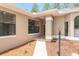 Well-maintained exterior with manicured landscaping, covered entry, and inviting walkway at 9180 Sw 202Nd Avenue Rd, Dunnellon, FL 34431