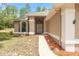 Beautiful front entrance with a patterned brick walkway leading to the home at 9180 Sw 202Nd Avenue Rd, Dunnellon, FL 34431