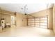 Attached garage featuring a utility sink, neutral walls, and a single-car door leading to the exterior at 9180 Sw 202Nd Avenue Rd, Dunnellon, FL 34431
