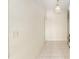Hallway with tiled floor, decorative light fixture, and entry to other rooms at 9180 Sw 202Nd Avenue Rd, Dunnellon, FL 34431