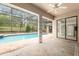 Inviting screened pool and patio area, complete with lush greenery and seamless access to the residence at 9180 Sw 202Nd Avenue Rd, Dunnellon, FL 34431
