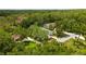 A lush green landscape surrounds this beautiful home with mature trees offering privacy and a serene environment at 9213 Sw 197Th Cir, Dunnellon, FL 34432