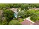 Beautiful home nestled among trees, with a screened-in pool and well-maintained lawn at 9213 Sw 197Th Cir, Dunnellon, FL 34432