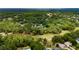 Areal view of property showcasing a home nestled within a dense, mature forest at 9213 Sw 197Th Cir, Dunnellon, FL 34432